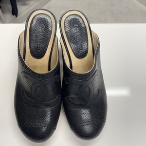 Chanel Black leather and wooden clogs